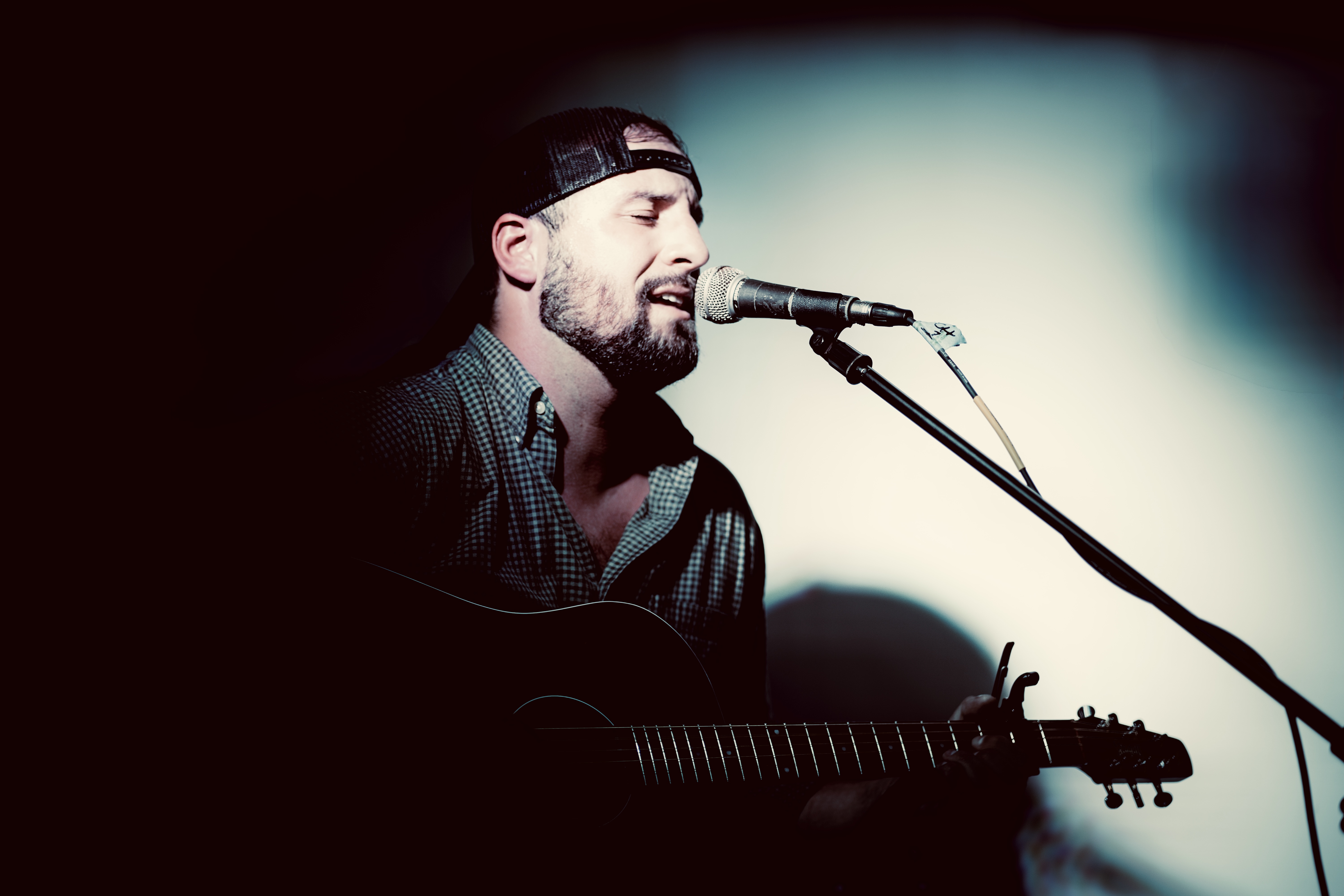 Ben Durand performing live with his guitar